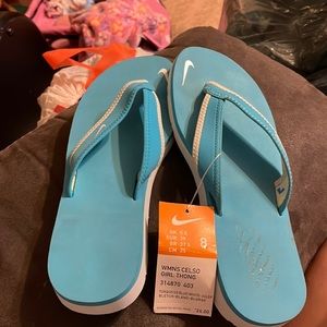 Nike women shoes size 8 never worn with tags only has one little spot on it